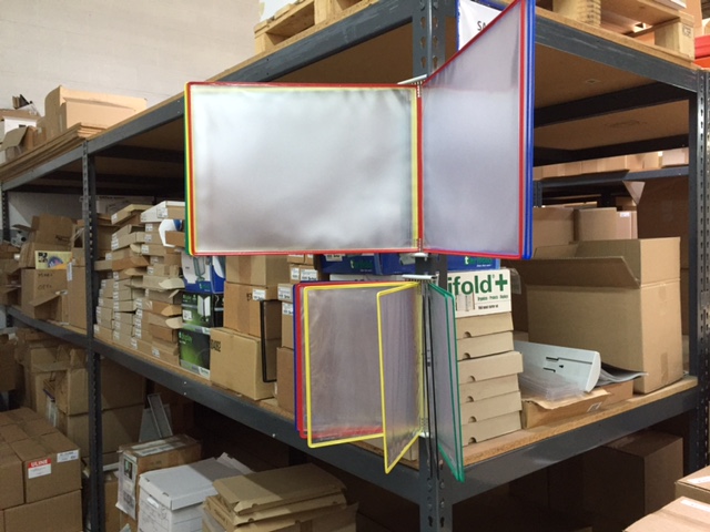 W291A3-LANDSCAPE TARIFOLD WALL ORGANIZER IN WAREHOUSE USE.